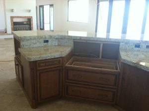 A kitchen with a sink and cabinets in it
